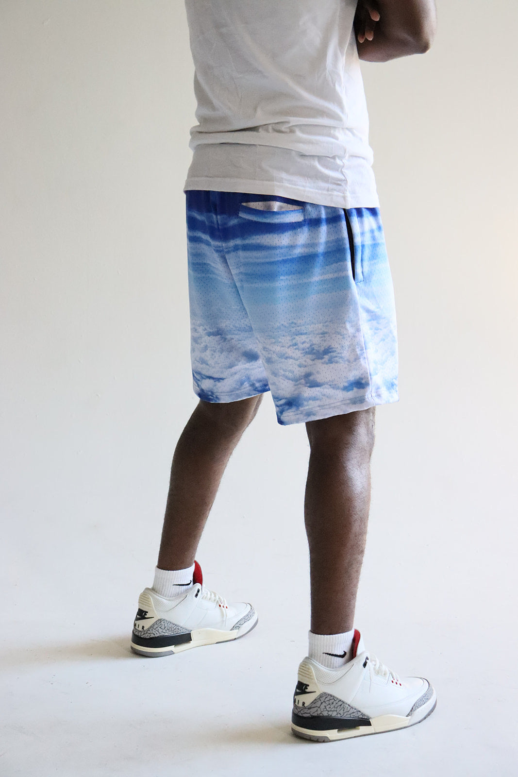 Men's graphic mesh shorts with a picture of sky clouds