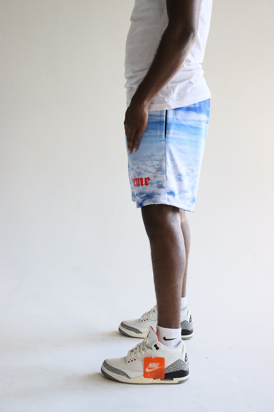 Men's graphic mesh shorts with a picture of sky clouds