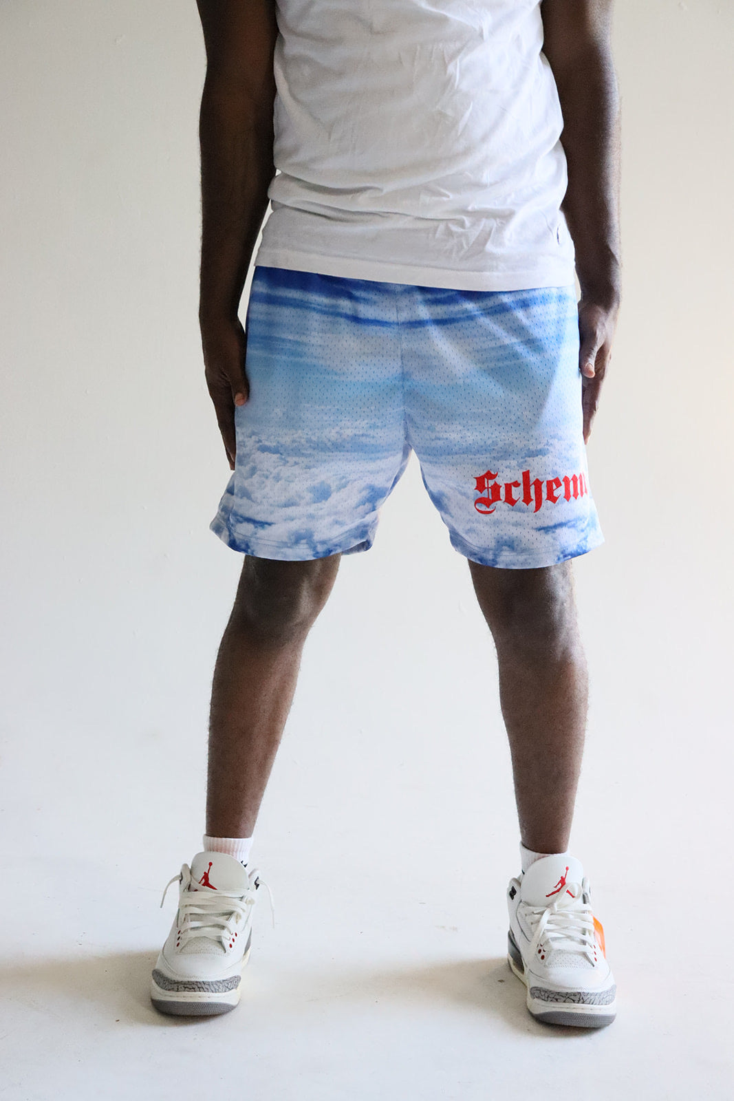 Men's graphic mesh shorts with a picture of sky clouds