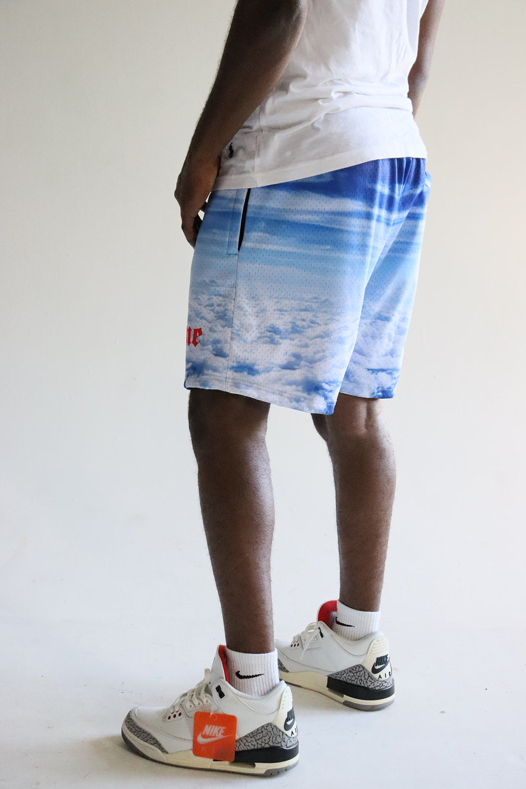 Men's graphic mesh shorts with a picture of sky clouds